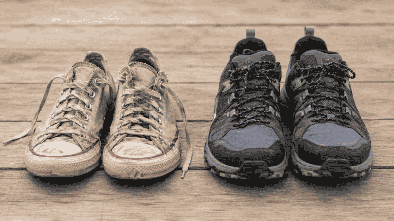 Comparison of worn cotton sneakers versus proper trail running shoes for beginner hikers